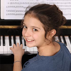 girl playing piano