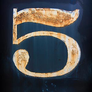 gold number 5 on navy blue background