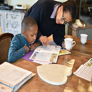 mom helping son study